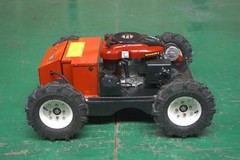 Remote-controlled gasoline lawn mower, suitable for backyards and outdoors.