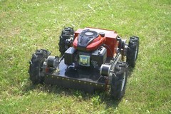 Remote-controlled gasoline lawn mower, suitable for backyards and outdoors.