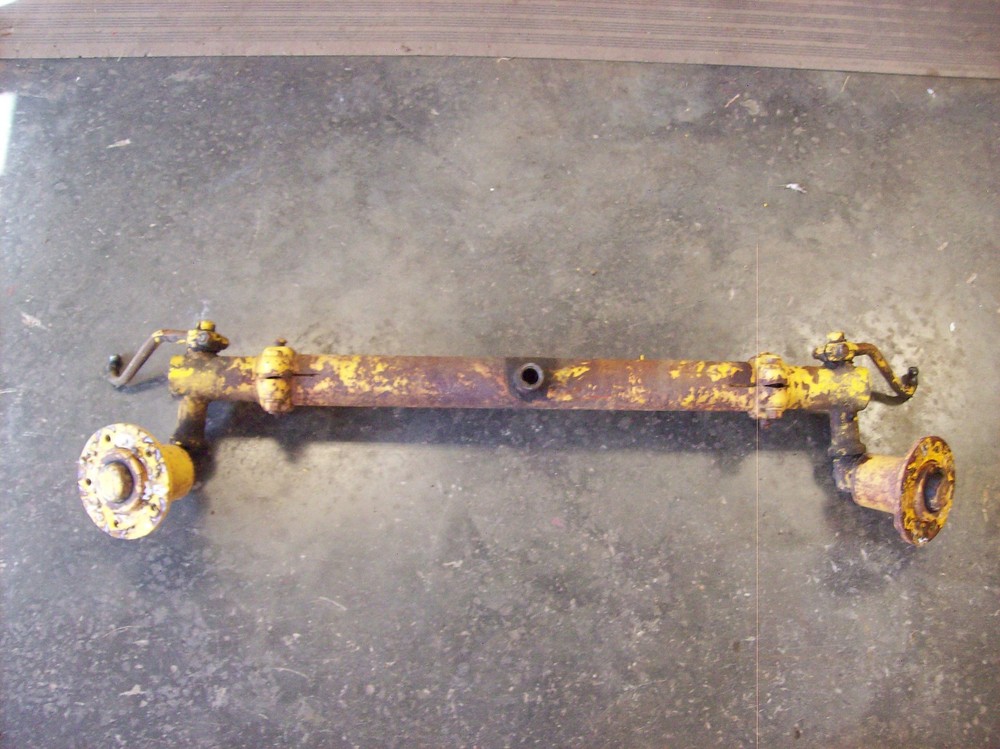 Farmall Cub International complete front axle with hubs and steering castings