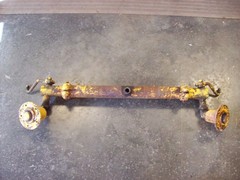 Farmall Cub International complete front axle with hubs and steering castings