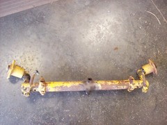 Farmall Cub International complete front axle with hubs and steering castings