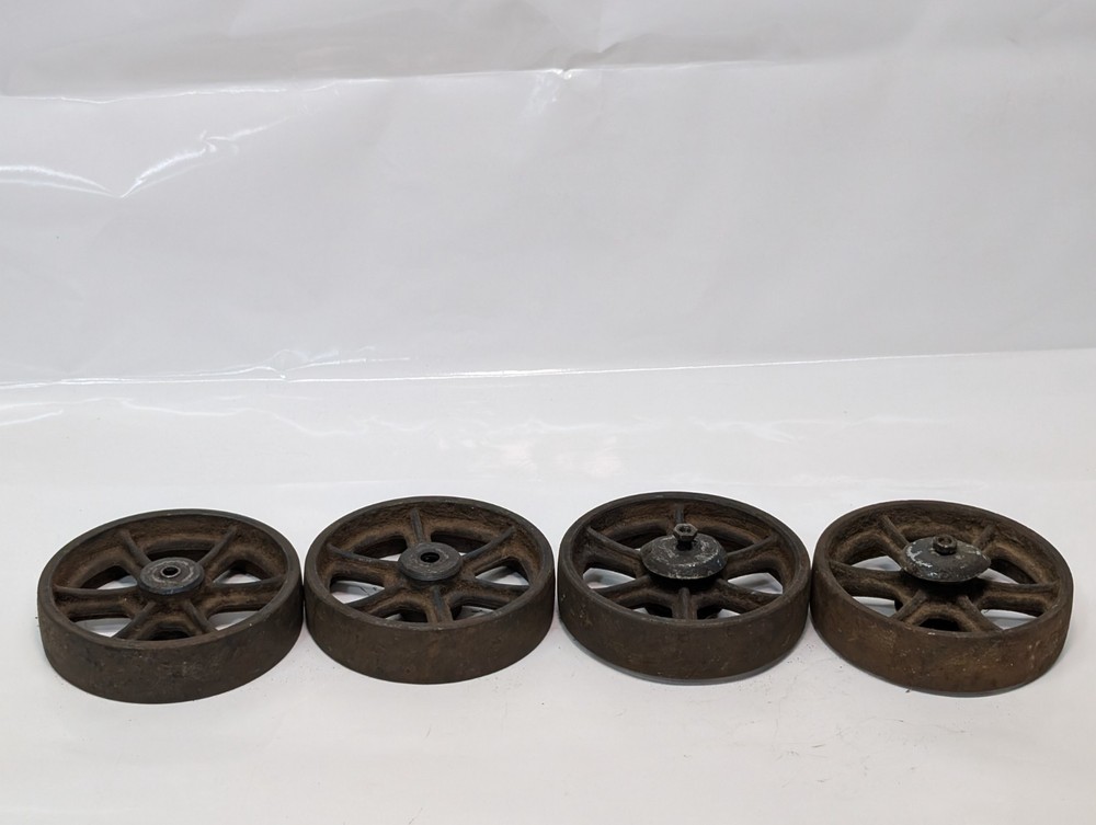 Lot of four antique cast-iron industrial pull cart caster wheels with 6 spokes