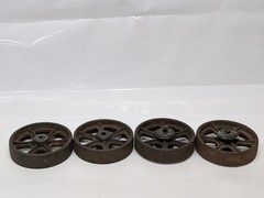 Lot of four antique cast-iron industrial pull cart caster wheels with 6 spokes