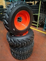 4 New 10-16.5 16PR R-4 Super HD Skid Steer Tires on 16.5×8.25 Orange Steel Rims