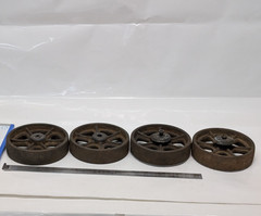 Lot of four antique cast-iron industrial pull cart caster wheels with 6 spokes