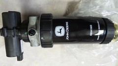 Unused John Deere RE541921 12V pump & filter combo.