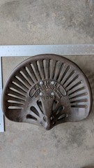 Vintage Tractor Seat Cast Steel Metal with Patina, with 1″ pipe flange bolted