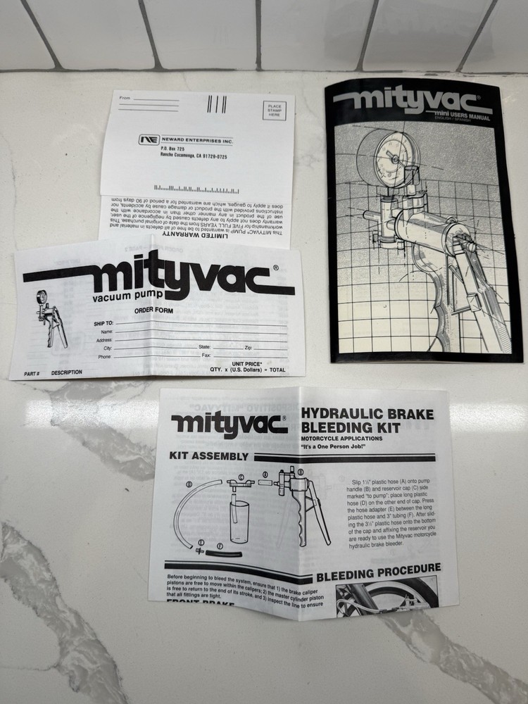 NEWARD ENTERPRISES MITYVAC MINI USERS MANUAL (ENGLISH/SPANISH)(DATED 1992) S2